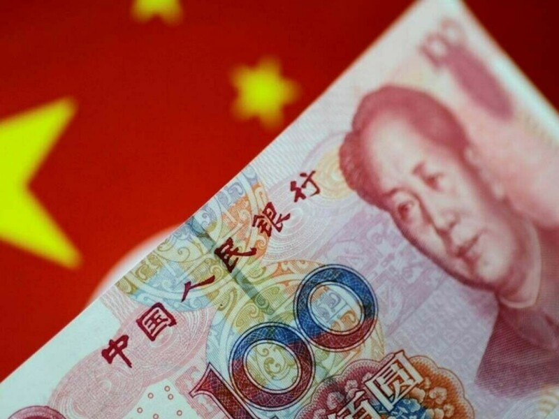 China’s yuan inches higher as PBOC support offsets dollar strength