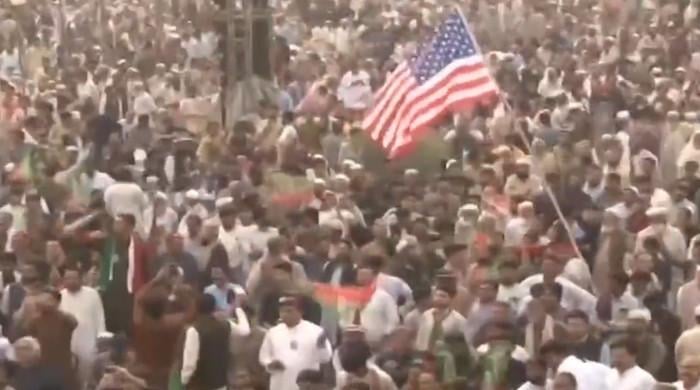 KP to take action against PTI worker over US flag display at Swabi rally